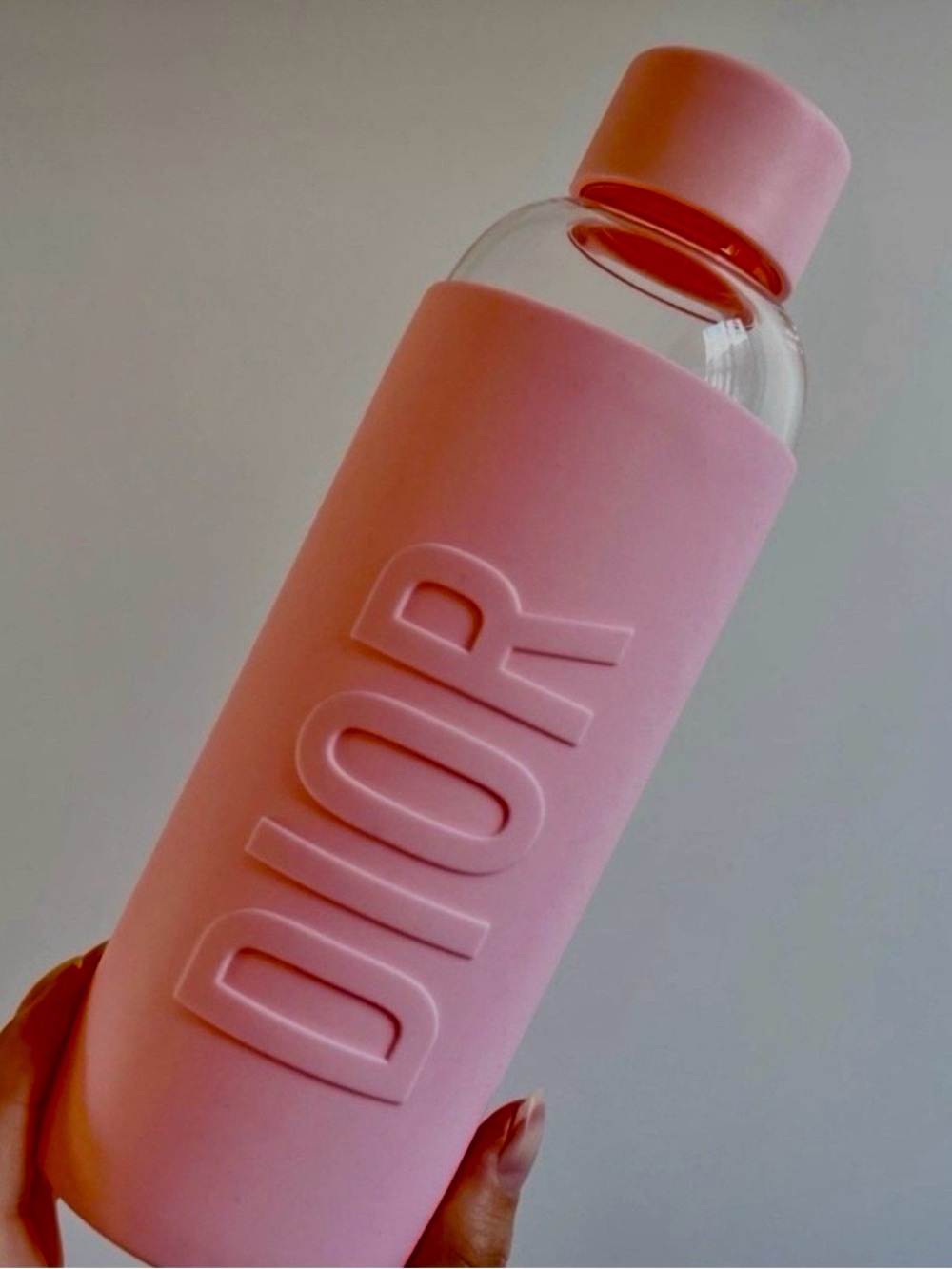 Dior Soft Pink Glass Bottle with Embossed Silicone Sleeve